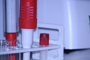 A close-up of laboratory equipment with a pipette