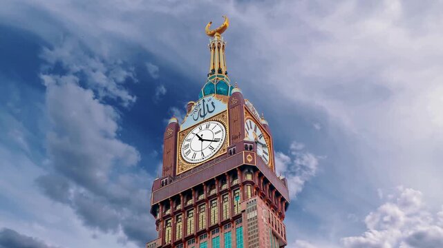 Mecca, Saudi Arabia with Abraj Al Bait (Royal Clock Tower Makkah) Translation: "There is no god but allah and Prophet Muhammed is his messenger" 
The Clock Towers, Abraj Al Bait, Mecca, Saudi Arabia.