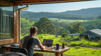 A man works from home with a view of nature outside an open window. The concept of remote work, freelancing
