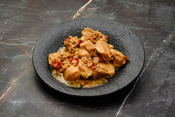 Traditional Georgian meal - kharcho, chicken fillet ragout with walnuts