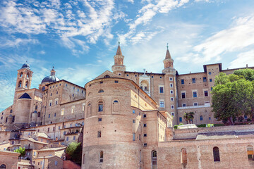 Cityscape of Italian town Urbino with majestic Palazzo Ducale. Palazzo Ducale Castle of the Dukes of Urbino, Italy