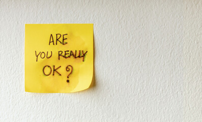 Mind, Mental Health and Encouragement Concepts. a Sticky Note with the Meaning of Care was taped on the white Wall