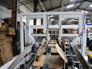 Bangalore, India 1st August 2024: Modern factory for the production of Corrugated Carton Boxes at a...