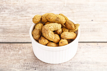 Raw ripe unpeeled peanut heap