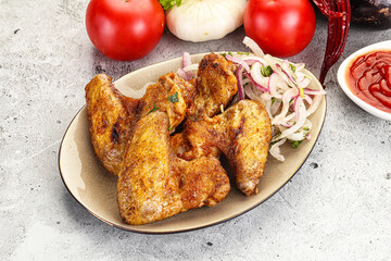 Grilled chicken wings with sauce