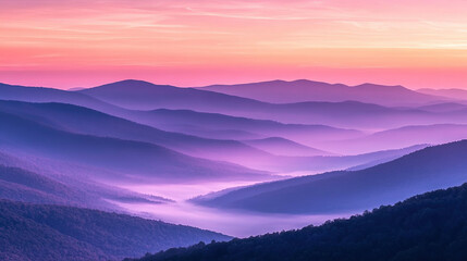 Obraz premium Breathtaking Sunrise Over Mountain Range with Pink and Orange Sky, Mist Gently Covering Valleys Below, Capturing the Serenity of Nature