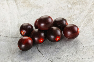 Raw ripe black kumato tomato