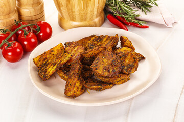 Golden baked potato Idaho with spices