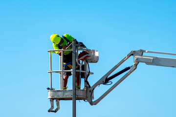 Electrician Working in a Boom Lift