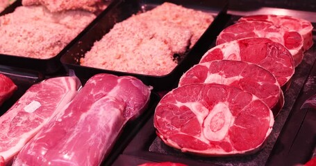 Raw beef meat osso buco shank steak lower part of cows foreleg. Red meat selection in butchers shop, fresh beef osso.