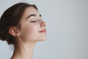 A close up of a girl's face with her eyes closed