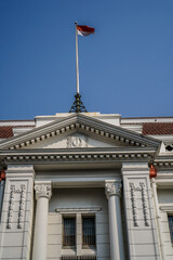 bottom view of classic old building against sky with empty photocopy space.