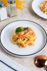 homemade fettuccine pasta with white cream sauce. fettuccine Carbonara, Italian food. Perfect for recipes, articles or any cooking content.