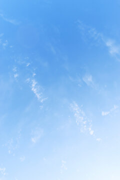 beautiful blue sky and white fluffy group of clouds with sunrise in the morning, natural background