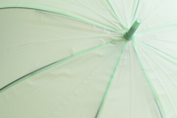 Obraz premium surface of open green umbrella background