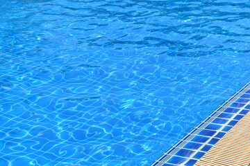 Obraz premium surface of blue swimming pool with water drain