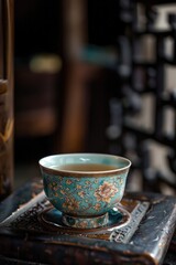 One tea cup on wooden table top.