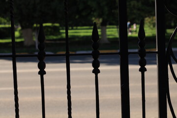 wrought fence at sunset
