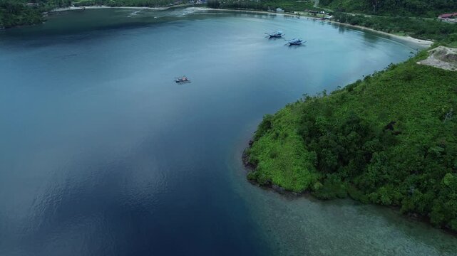 Pesisir Selatan, Indonesia - June 13, 2024: Aerial drone views of the stunning Mandeh area, showcasing its breathtaking coastal landscapes, vibrant marine life, and lush tropical greenery. 