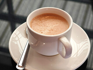 Hot Thai tea latte in a cup