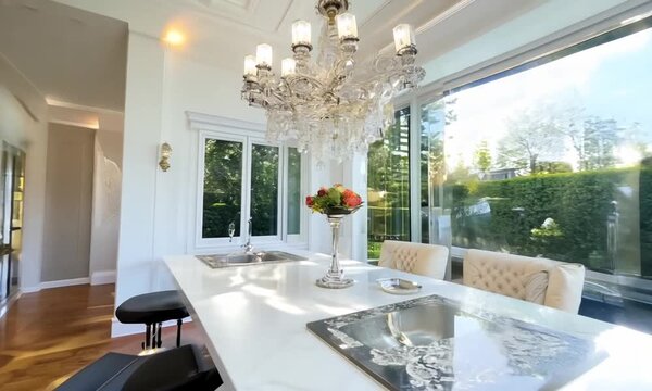 A bright, modern white kitchen in an estate home