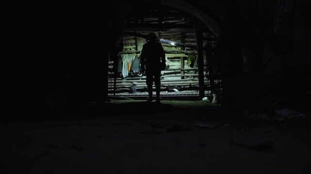 coal miner goes to work in dark mine