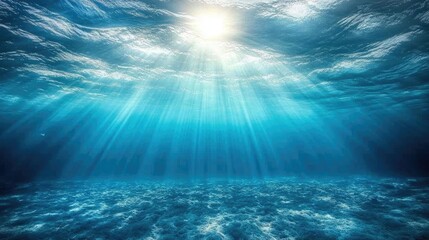 Ocean view from beneath the water, with sun rays casting a magical glow.