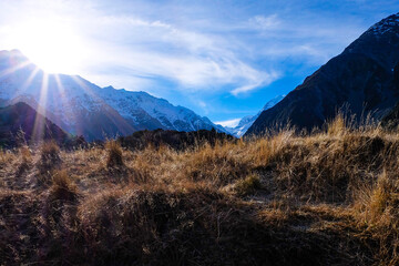 Hiking in a beautiful sunny blue sky winter day at Mount Cook national park,  South Island New...