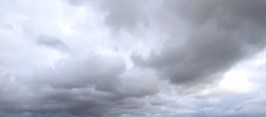 Grey dramatic sky with storm clouds dark landscape.