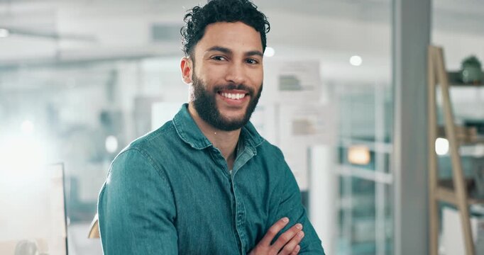 Man, arms crossed and smile in office, face and pride for career with confidence at small business. Professional person, writer and portrait at startup in workplace at creative agency in Colombia