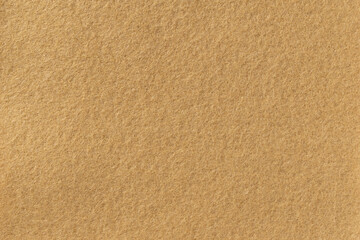 Close up image of felt texture background fabric material illustration wallpaper light brown color