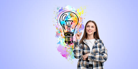 Woman pointing at colorful light bulb illustration on pastel bac