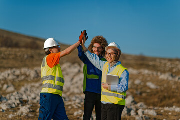 Engineers Collaborating in the Field to Inspect and Optimize Electric Turbines.