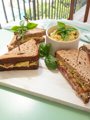 Rye bread sandwich with italian ham and avocado cashew spread