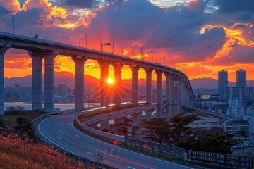 Sunset Over Cityscape With Bridge And Highway