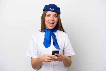 Airplane Lithuanian woman stewardess isolated on white background surprised and sending a message