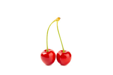 Cherry isolated. Fresh ripe cherries with leaves isolated on a white background.Sweet cherries pile. Berries and fruits. Vegan. Healthy eating.