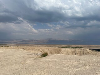 Landscape in Israeli desert, Judea and Samaria, Dead Sea on the background