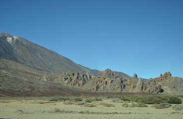 Scenic view of volcanic rock formations in desert during sunny day, Teide National Park, Tenerife