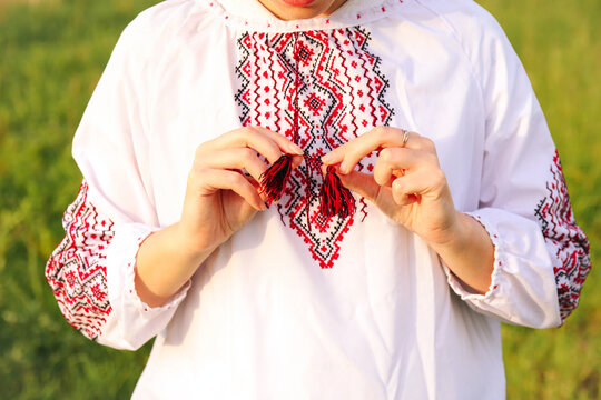 Fototapeta The close-up showcases a woman wearing a vyshyvanka, emphasizing the cultural significance of the embroidery. Embroidery Ukrainian pattern background featuring red and black Ukrainian ornaments