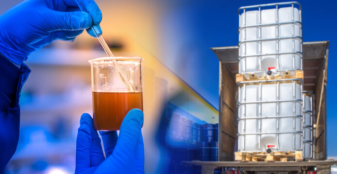Checking quality of oil. Fuel in flask in hand of laboratory assistant. IBC containers in back of truck. Check fuel before delivery. Oil analysis before use. Petroleum quality test.