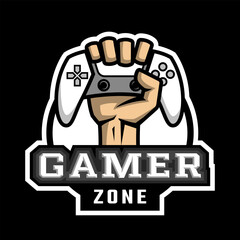 The hand holds the controller. Hardcore gamer logo on a dark background.