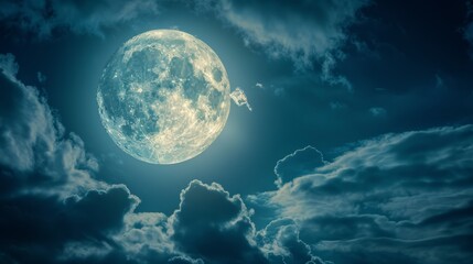 Fototapeta premium Beautiful night sky photo with a bright, cloudy full moon. Beautiful night sky with a bright, cloudy full moon.