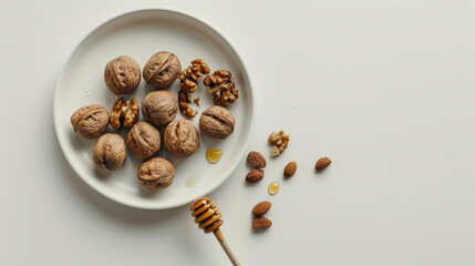 Obraz premium A beautifully arranged plate of whole walnuts and almonds with a honey dipper, celebrating natural, healthy food and simple pleasures.