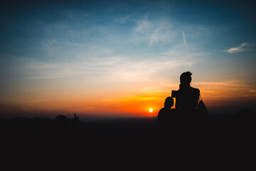 Epic Adventure at Sunset, Silhouetted people trekking Mountain Peaks, Embracing Nature's Freedom and Success in Hiking, Sunrise to Sunset Journey, Extreme Sports Lifestyle, Beautiful Landscapes