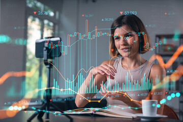 Woman analyzing stock charts overlayed on her workspace background.
