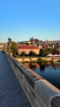 Morning footage of Charles Bridge (Karlův Most) and the Old Town in Prague, Czech Republic, vertical.