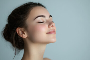 A close up of a girl's face with her eyes closed