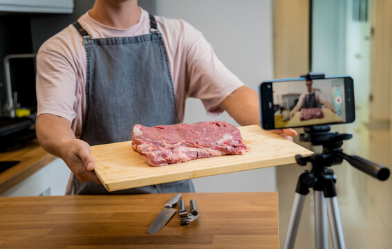 The chef is broadcasting live from workshop how to prepare a beef steaks on the electric grill