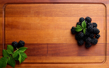 black ripe blackberries on wooden tray blackberries close up
